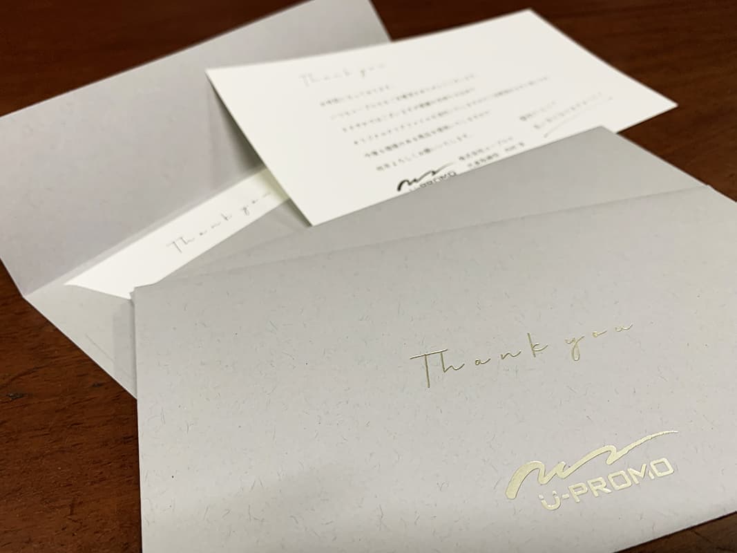 挨拶状・箔押し封筒デザイン